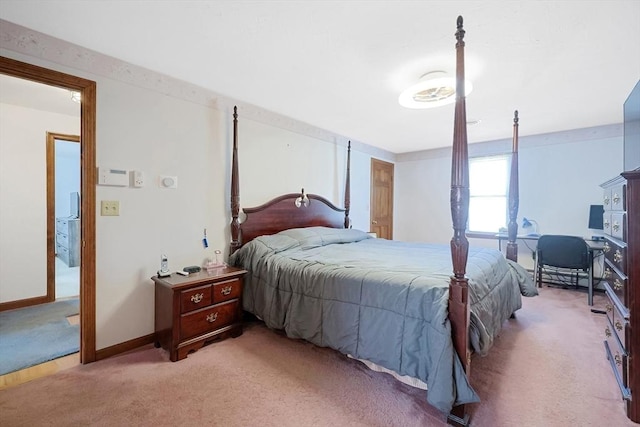 bedroom with light carpet and baseboards