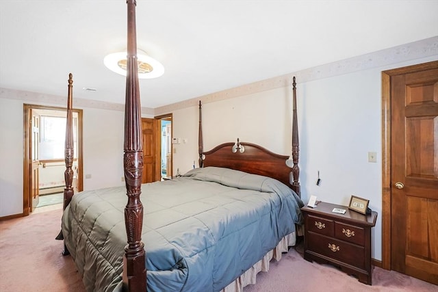 bedroom featuring baseboards, baseboard heating, and light colored carpet