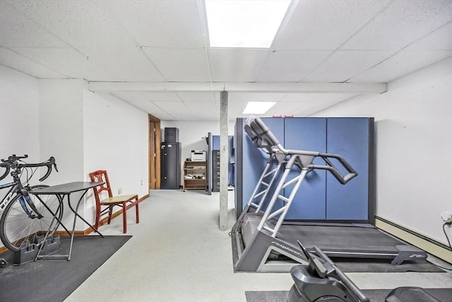 workout area featuring a paneled ceiling