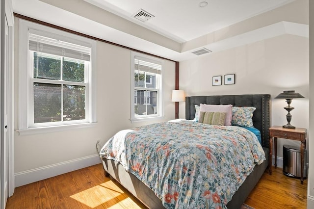 bedroom featuring wood-type flooring