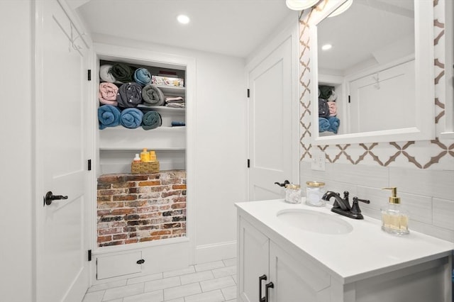 bathroom with backsplash and vanity