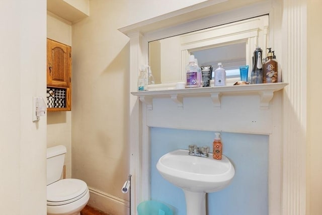 bathroom with sink and toilet