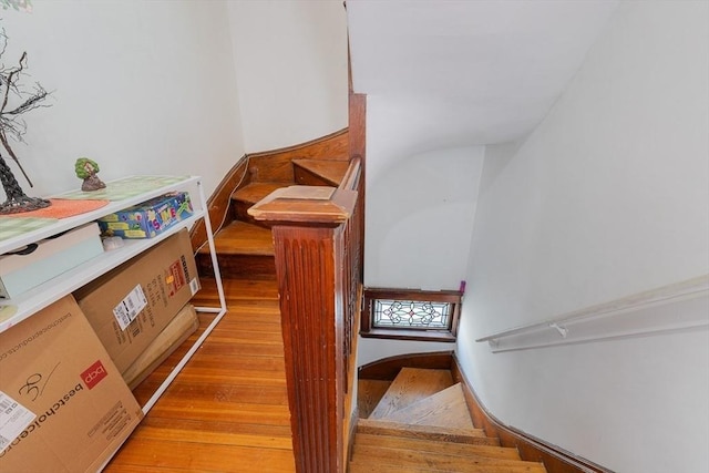 stairs featuring hardwood / wood-style flooring