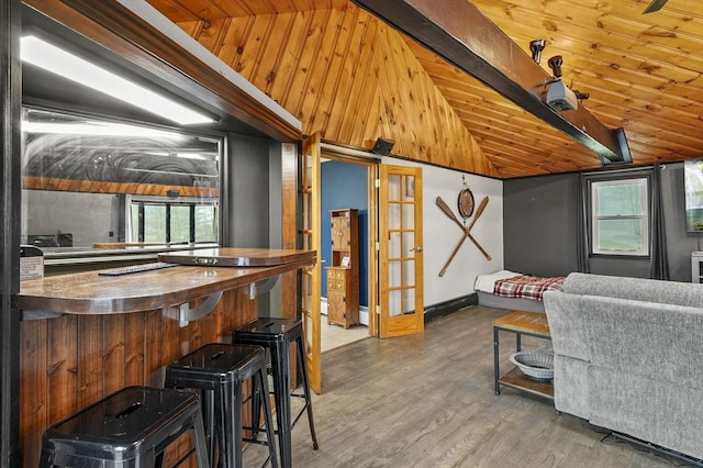 93 Lincoln Ave, Ashburnham, MA 01430 - living area featuring healthy amount of natural light, wood finished floors, wooden ceiling, baseboards, and french doors
