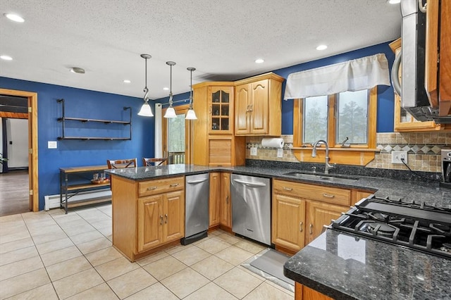 93 Lincoln Ave, Ashburnham, MA 01430 - kitchen with appliances with stainless steel finishes, a sink, a peninsula, baseboard heating, and decorative backsplash