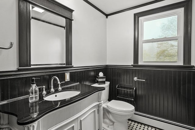 93 Lincoln Ave, Ashburnham, MA 01430 - bathroom with baseboard heating, a wainscoted wall, vanity, toilet, and crown molding