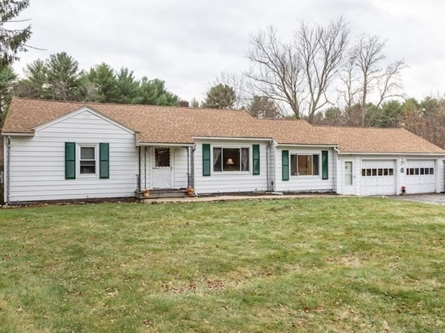 single story home with a garage and a front yard