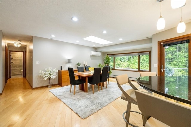 21 Birch Ln, Northampton, MA 01062 - dining area with a skylight, baseboards, light wood-style floors, a wall mounted air conditioner, and recessed lighting