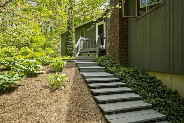 21 Birch Ln, Northampton, MA 01062 - entrance to property featuring brick siding and a wooden deck