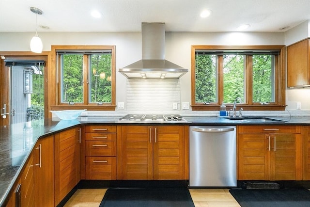 21 Birch Ln, Northampton, MA 01062 - kitchen with appliances with stainless steel finishes, ventilation hood, dark stone countertops, brown cabinetry, and plenty of natural light