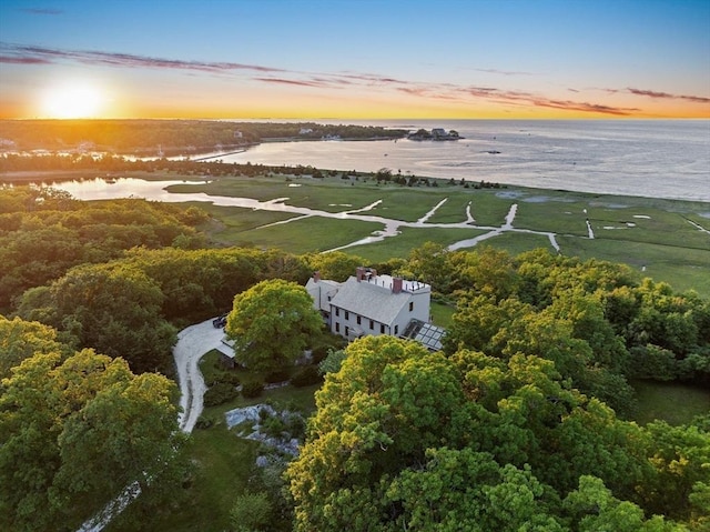 aerial view at dusk with a water view