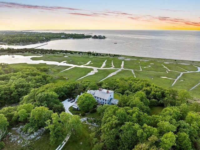 aerial view at dusk with a water view