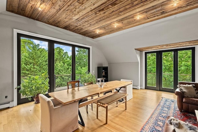 dining area featuring a baseboard heating unit, wood ceiling, light hardwood / wood-style flooring, and vaulted ceiling