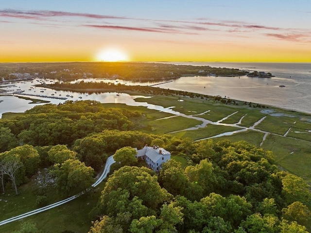 aerial view at dusk with a water view