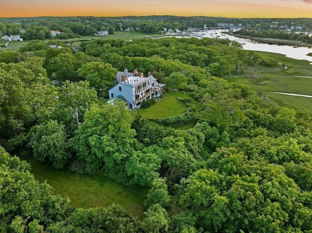 aerial view at dusk with a water view