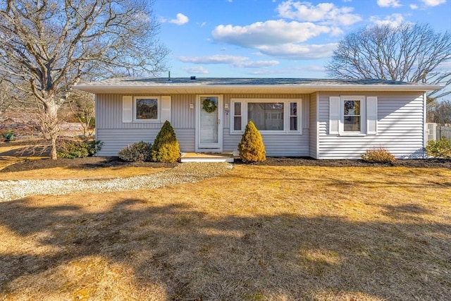 single story home featuring a front yard