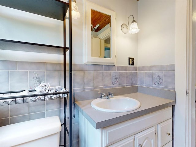 8 Shepard Ave, Pembroke, MA 02359 - half bathroom featuring vanity and tasteful backsplash