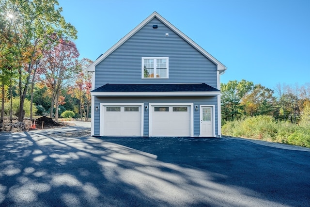 view of property exterior featuring a garage