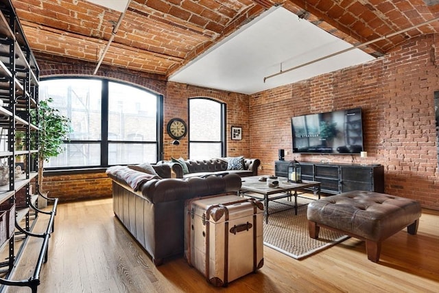 121-123 Beach St Unit 603, Boston, MA 02111 - living area with brick ceiling, brick wall, and wood-type flooring