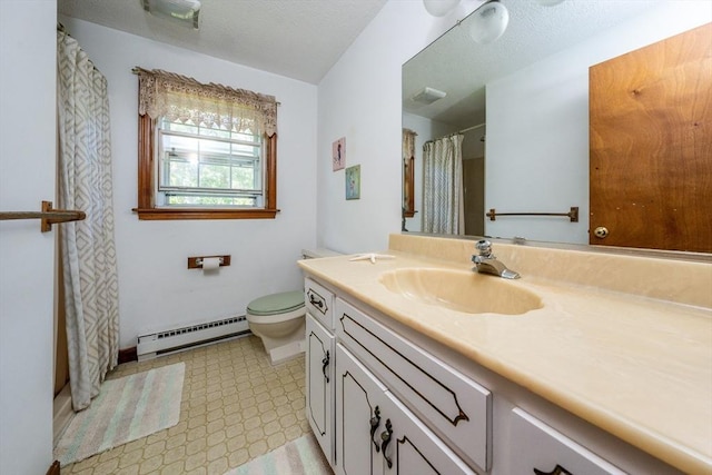 bathroom featuring a textured ceiling, vanity, toilet, and baseboard heating