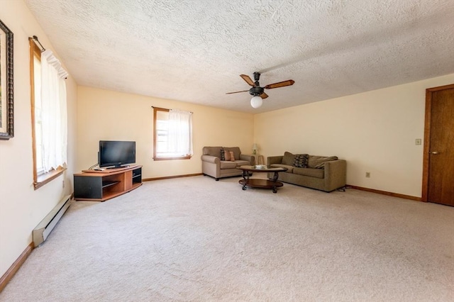 carpeted living room with a textured ceiling, baseboard heating, and ceiling fan