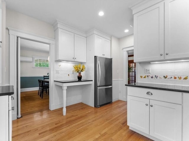 161 Playstead Rd, Medford, MA 02155 - kitchen featuring freestanding refrigerator, white cabinets, light wood-style floors, backsplash, and recessed lighting
