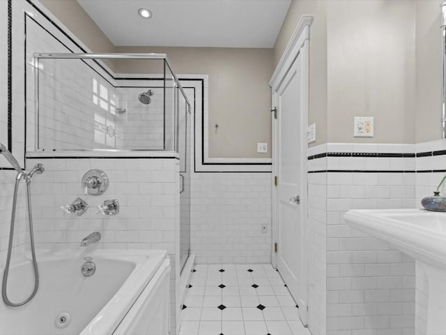 161 Playstead Rd, Medford, MA 02155 - full bathroom featuring tile walls, a bathtub, a stall shower, tile patterned flooring, and a wainscoted wall