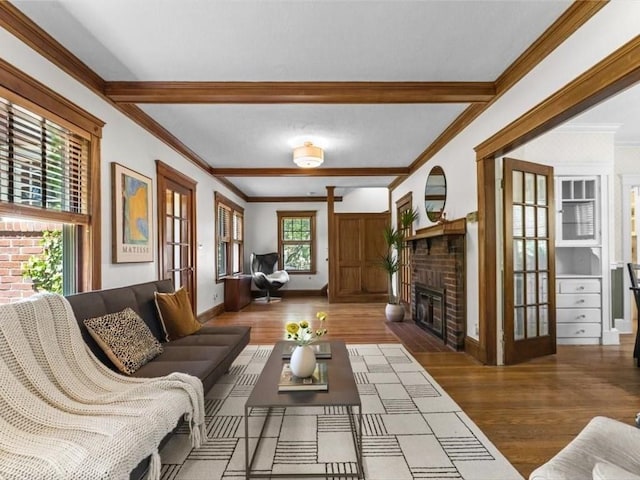 161 Playstead Rd, Medford, MA 02155 - living area featuring wood finished floors, a brick fireplace, beam ceiling, and ornamental molding