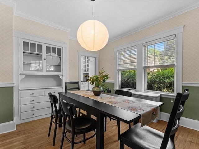 161 Playstead Rd, Medford, MA 02155 - dining space featuring ornamental molding, wallpapered walls, and wood finished floors