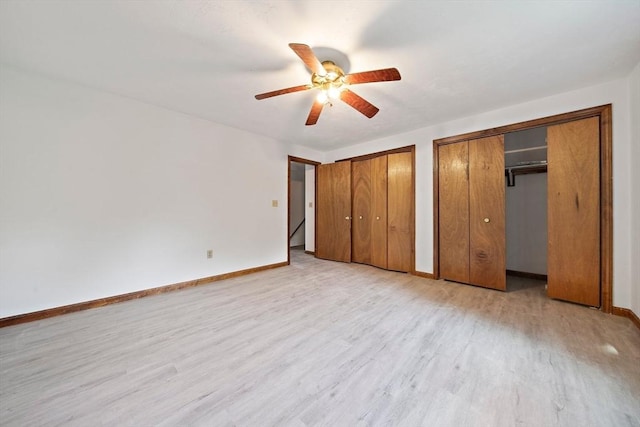 32-34 Lawn St, Attleboro, MA 02703 - unfurnished bedroom with two closets, light wood-type flooring, baseboards, and a ceiling fan