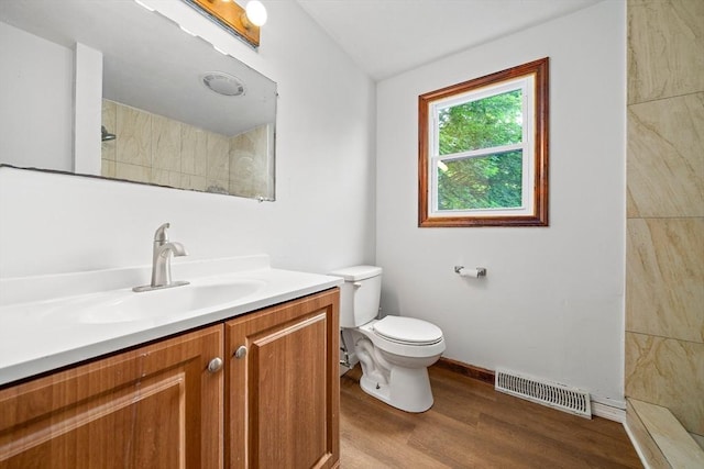 32-34 Lawn St, Attleboro, MA 02703 - full bath featuring toilet, wood finished floors, vanity, and a tile shower