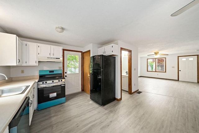 32-34 Lawn St, Attleboro, MA 02703 - kitchen with freestanding refrigerator, stainless steel range with electric cooktop, under cabinet range hood, a sink, and dishwashing machine