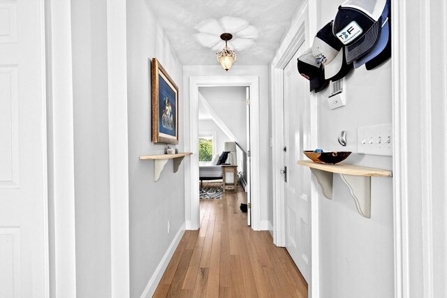 646 Jerusalem Rd Unit 7, Cohasset, MA 02025 - hall with light wood-type flooring and baseboards