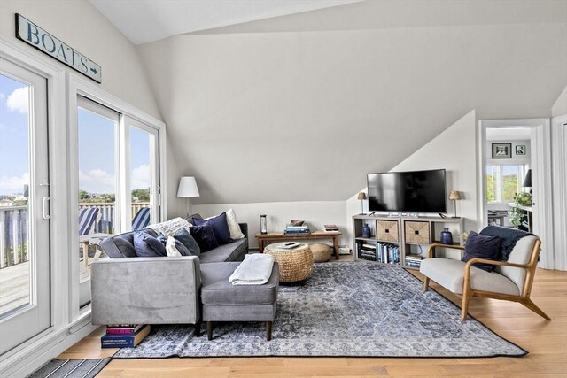 646 Jerusalem Rd Unit 7, Cohasset, MA 02025 - living area with vaulted ceiling, healthy amount of natural light, and wood finished floors
