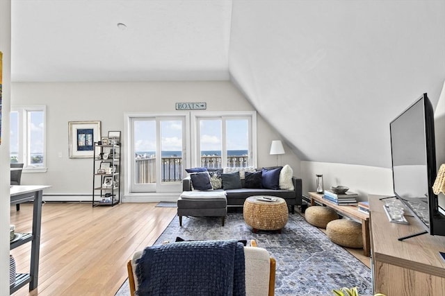 646 Jerusalem Rd Unit 7, Cohasset, MA 02025 - living area with plenty of natural light, vaulted ceiling, light wood-style floors, and baseboard heating