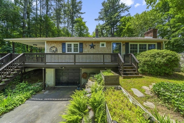 255 State St, Belchertown, MA 01007 - view of front facade featuring stairs, a chimney, a garage, and driveway