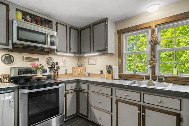 255 State St, Belchertown, MA 01007 - kitchen featuring appliances with stainless steel finishes, healthy amount of natural light, and gray cabinets
