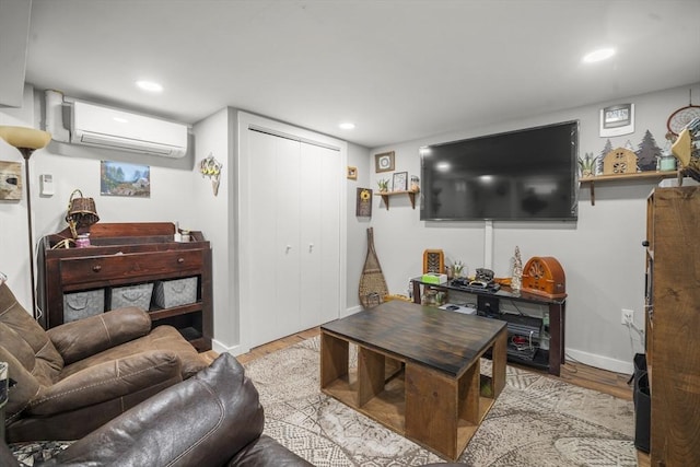 255 State St, Belchertown, MA 01007 - living area with an AC wall unit, wood finished floors, and recessed lighting