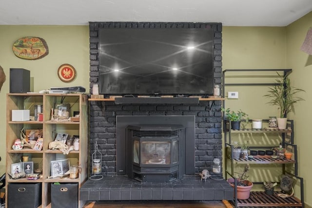 255 State St, Belchertown, MA 01007 - detailed view of a wood stove and wood finished floors
