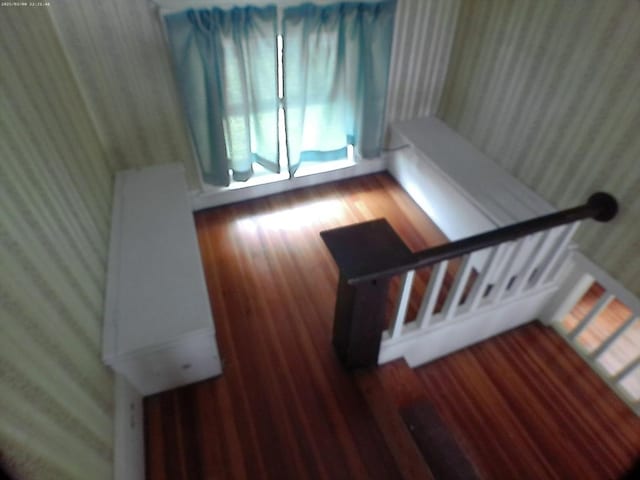 39 King St, Holyoke, MA 01040 - staircase with wallpapered walls, wood finished floors, and healthy amount of natural light