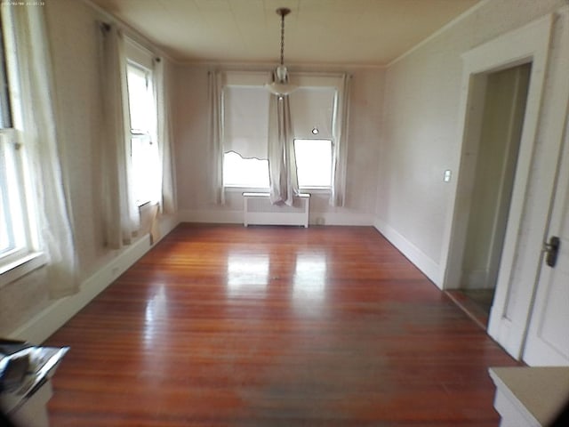 39 King St, Holyoke, MA 01040 - unfurnished dining area with radiator heating unit, wood finished floors, ornamental molding, and baseboards