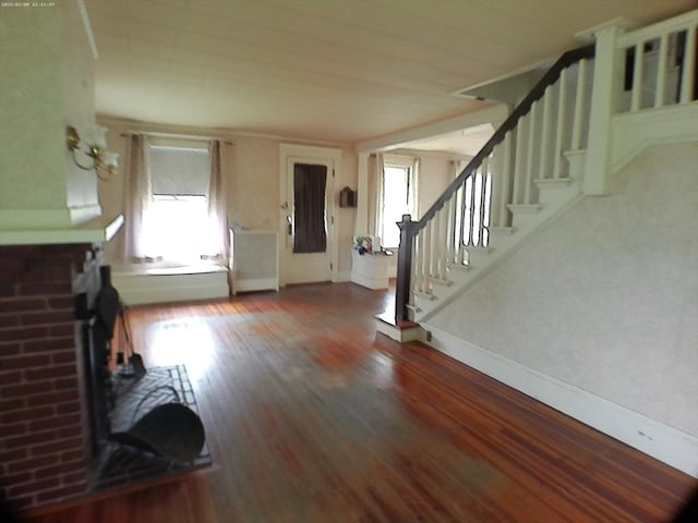 39 King St, Holyoke, MA 01040 - unfurnished living room featuring healthy amount of natural light, baseboards, and stairway