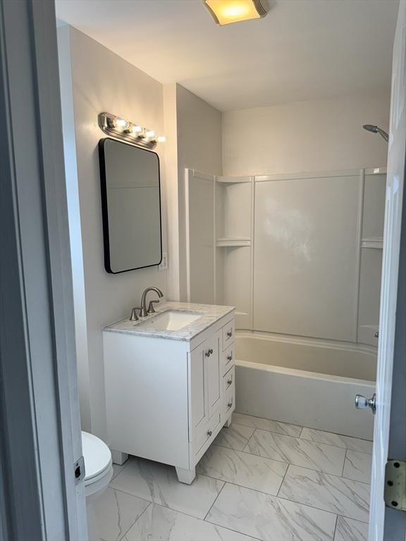 full bathroom featuring vanity, toilet, and shower / bath combination