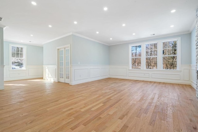 unfurnished room with recessed lighting, visible vents, crown molding, and light wood-style flooring