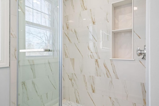 full bathroom featuring a marble finish shower