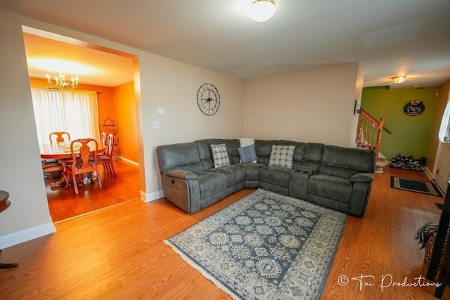 115 Arnold St, Fall River, MA 02724 - living area featuring stairs, wood finished floors, a chandelier, and baseboards