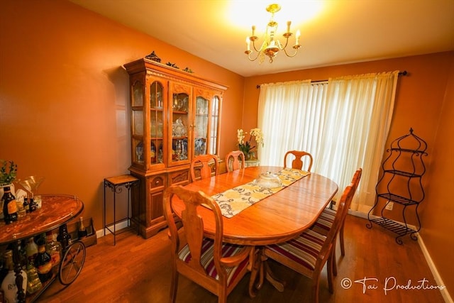 115 Arnold St, Fall River, MA 02724 - dining room with wood finished floors, a chandelier, and baseboards