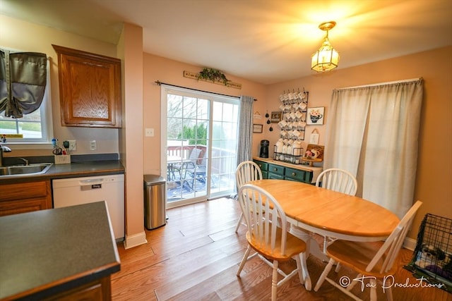 115 Arnold St, Fall River, MA 02724 - dining area with light wood-style flooring and baseboards