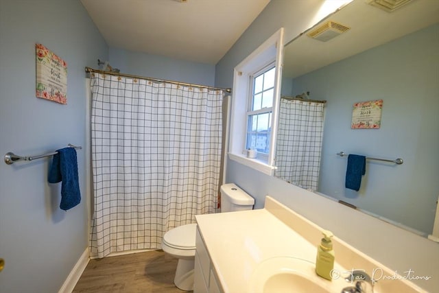 115 Arnold St, Fall River, MA 02724 - bathroom with visible vents, a shower with shower curtain, toilet, wood finished floors, and vanity