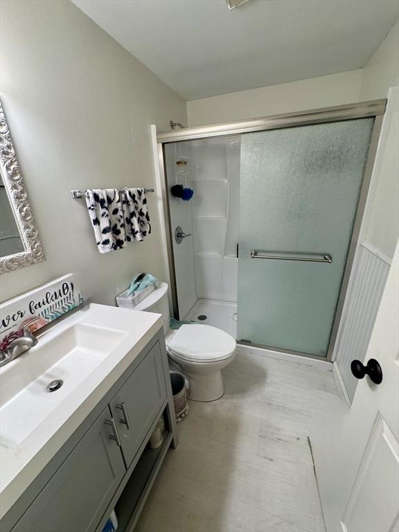 39 Pine Grove Rd, Yarmouth, MA 02664 - full bath featuring vanity, a stall shower, and toilet